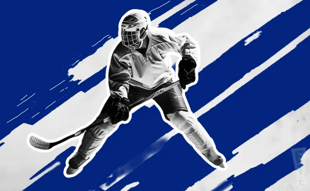 a lincoln stars hockey player about to hit the puck